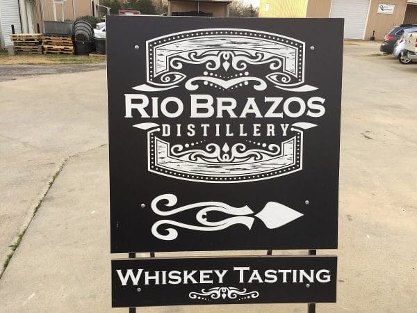 Rio Brazos Distillery sign