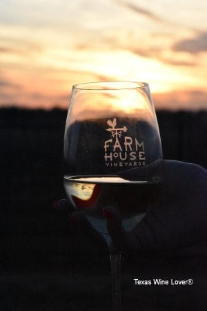 Farmhouse Vineyards glass in sunset