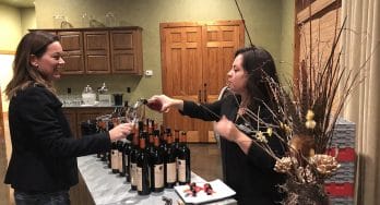 Pouring wine at Brennan's Library Heist