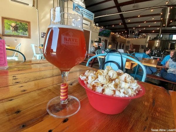 Save the World beer and popcorn