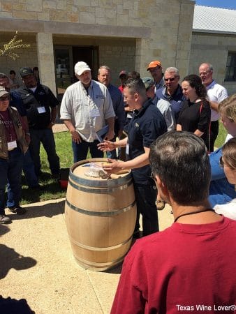 A Cooper demonstrating barrel maintenance techniques for a seminar presented at a Texas Hill Country Wineries Symposium. 